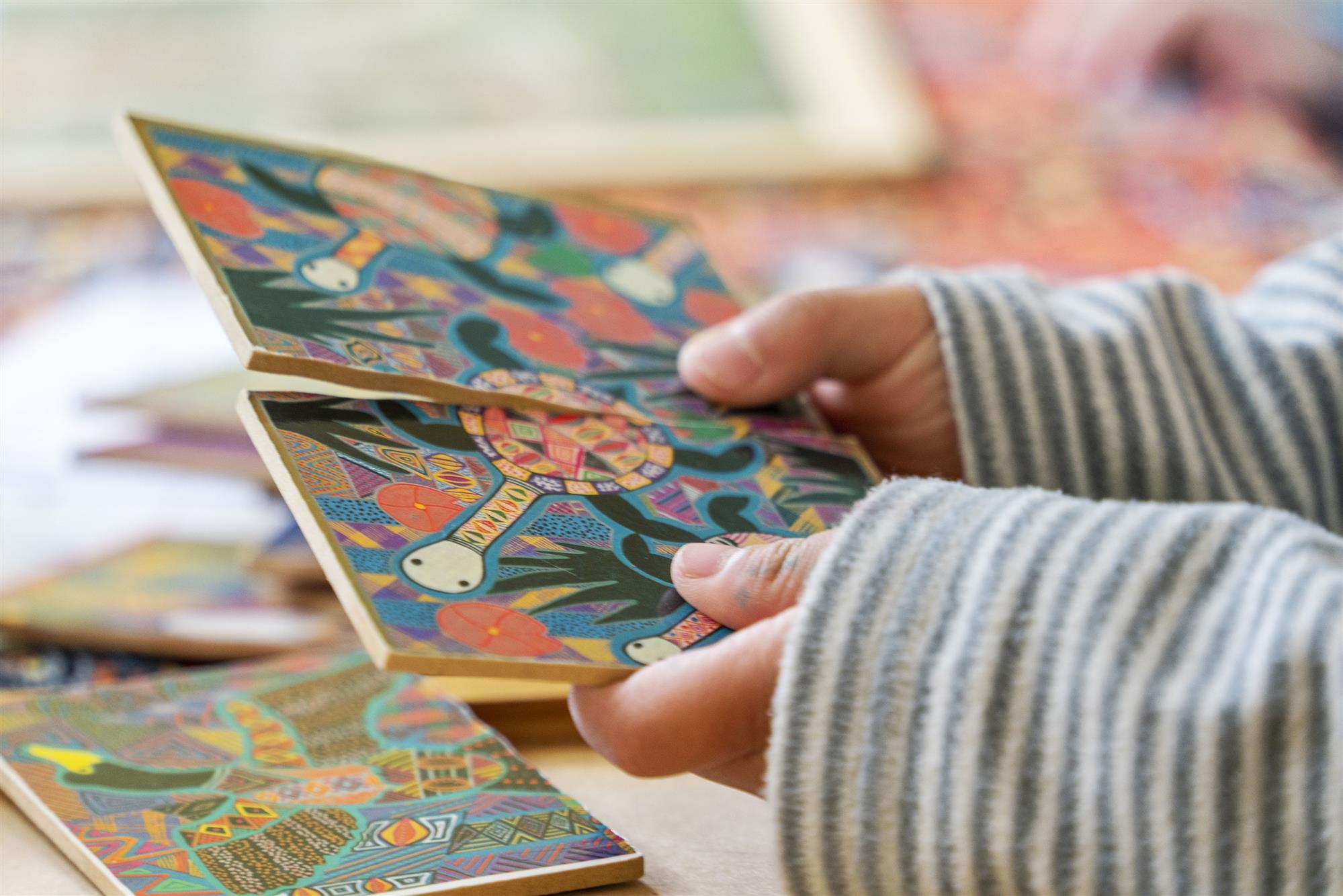 Child holding picture cards