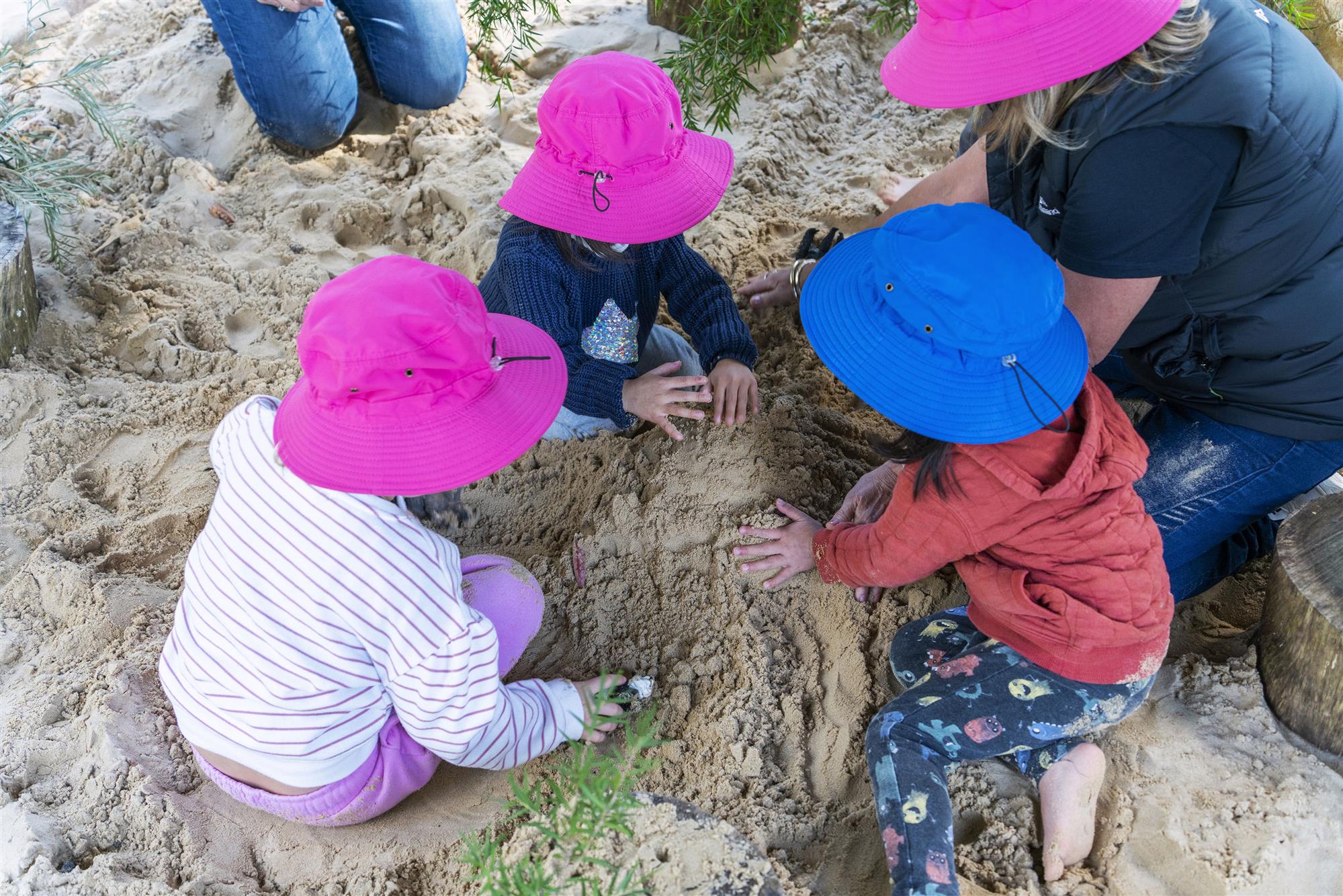 Children building sandcastle